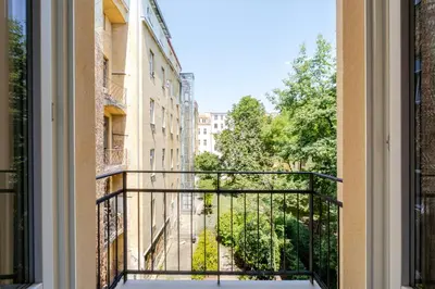 a balcony with a view of a street at Blueground Letná furnished studio foodie area PRG-54 in Prague