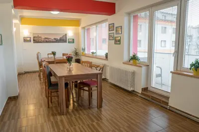 a dining room with a table and chairs at Penzion Staré Louny in Louny