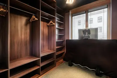 a kitchen with white cabinets and a sink at Gentleman Spirit Residence Prague in Prague