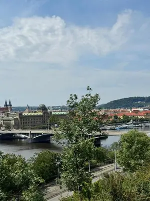 a view of a river with a bridge and a city at Downtown Prague in Prague