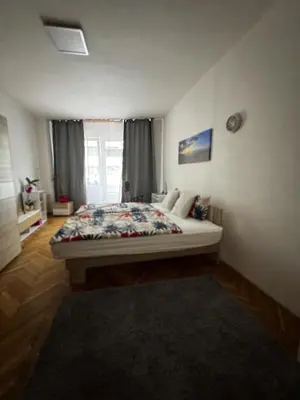 a bedroom with a bed in a room with a window at Downtown Prague in Prague