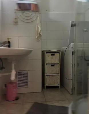 a small bathroom with a sink and a shower at Downtown Prague in Prague
