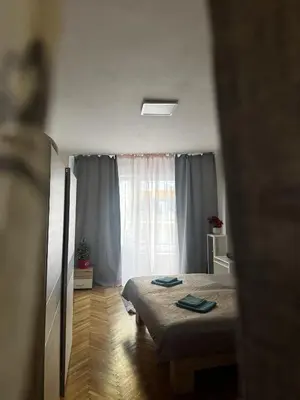 a bedroom with a bed and a window at Downtown Prague in Prague