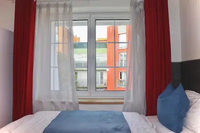 a bedroom with a bed and a window at Royal Villas in Prague