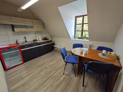 a kitchen and dining room with a table and chairs at Apartmány Zámecká in Roudnice nad Labem