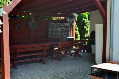 a group of benches sitting on a patio at Newly renovated house near Prague in Nové Jirny