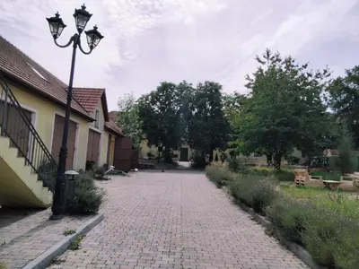 a cobblestone street with a street light next to a building at Statek Otradovice hotel