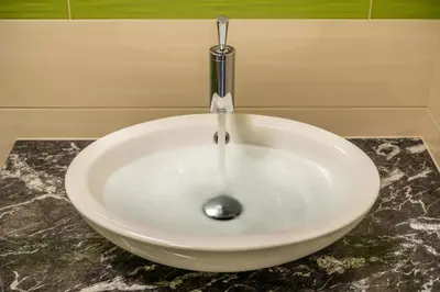 a white sink sitting on top of a counter at Olivův Pivovar in Dolní Břežany