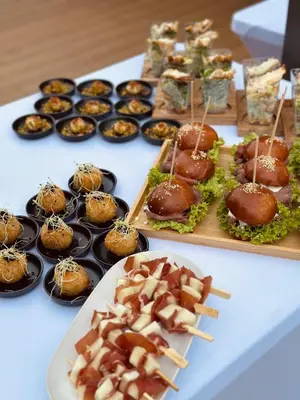 a table topped with different types of food on sticks at Čerčanská Koupadla - glampingové stany in Benešov
