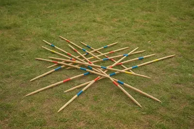 a pile of wooden baseball bats on the grass at Caravan on farm