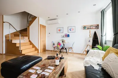 a living room with a couch and a table at Prague Days - Maisonette Retreat with Terrace, AC and TV Tower View in Prague