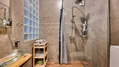 a bathroom with a shower with a glass door at Stylish Flat in Top Area ! New with Great Access in Prague