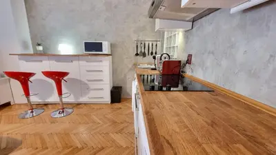 a kitchen with red bar stools in a room at Stylish Flat in Top Area ! New with Great Access in Prague