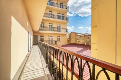 a balcony with a view of a building at Cozy Nest by Karlín Square in Prague