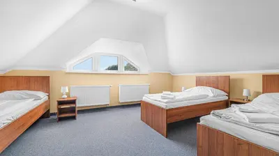 a room with two beds and a window at Hotel Samechov - konferenční hotel in Samechov