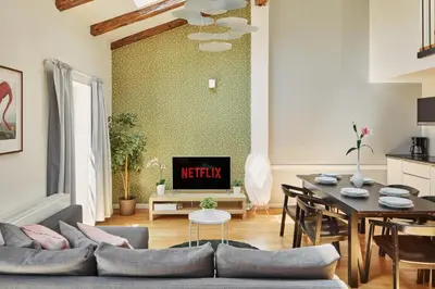 a living room with a couch and a table at Prague Days - Maisonette with AC and 2 Bathrooms in New Town in Prague