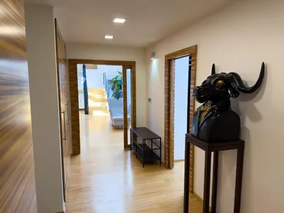 a hallway with a statue of a demon at Loft-style& Modern Apartment in the center of Prague in Prague