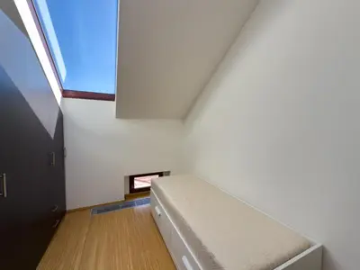 a bed in a room with a window at Loft-style& Modern Apartment in the center of Prague in Prague