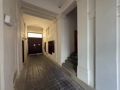 an empty hallway of a building with a door at Loft-style& Modern Apartment in the center of Prague in Prague