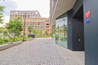 an empty street in front of a building at Luxury apartment in Smíchov in Prague
