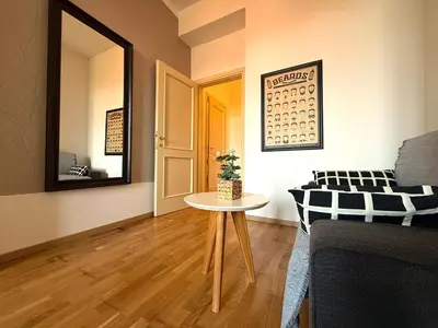 a living room with a table and a couch at Peaceful 1Bedroom Flat at Local side of the Center in Prague