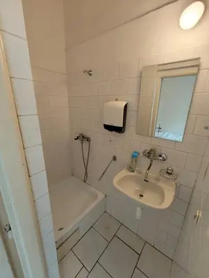 a bathroom with a sink and a tub and a sink and a bath tub at Comfy 2rooms Flat 4 persons & Parking in Prague