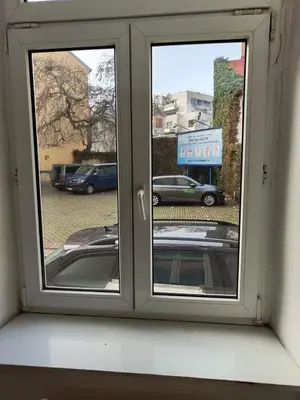 a window with a view of a parking lot at Comfy 2rooms Flat 4 persons & Parking in Prague