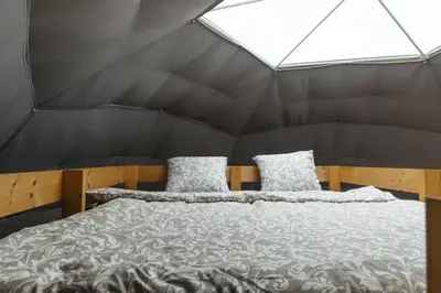 a bedroom with a bed in a tent at Glamping Prague Louka in Prague