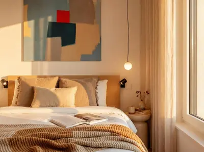 a bedroom with a bed with a book on it at Turnkey I Henry's Tower Apartments in Prague