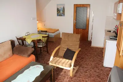 a living room with a couch and a table at Apartment Příbram in Příbram
