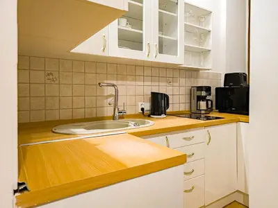a kitchen with a sink and a microwave at Quiet Central Station Apartments in Prague