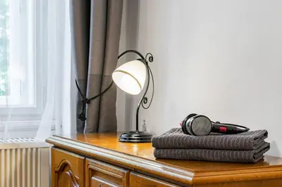 a living room with a couch and a table at Charming Loft Studio Near Metro & Old Town in Prague
