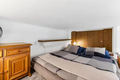 a car parked in front of a store on a street at Charming Loft Studio Near Metro & Old Town in Prague
