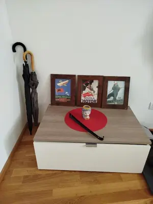 a table with a red plate and a fork and knife at Riverside Praha Apartament in Prague