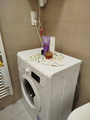 a washer and dryer in a bathroom at Riverside Praha Apartament in Prague