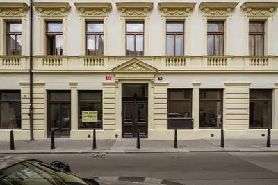 a large white building with a sign in front of it at Prague Days - Fully Equipped Studio near Wenceslas Square in Prague