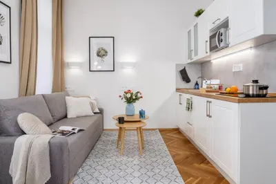 a living room with a couch and a table at Prague Days - Fully Equipped Studio near Wenceslas Square in Prague