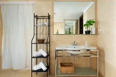 a bathroom with a sink and a mirror at Prague Days - Family Friendly Apartment with AC and Netflix in Old Town in Prague