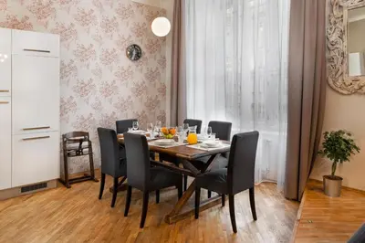 a dining room with a table and chairs at Prague Days - Family Friendly Apartment with AC and Netflix in Old Town in Prague