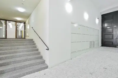 a staircase in a building with a black door at Rhapsody in Prague