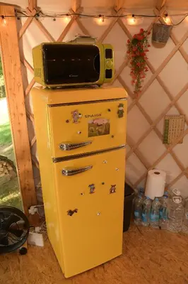 a yellow refrigerator with a microwave on top of it at 01 JURTA šedá u stodoly