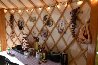a room with a table with pictures on a wall at 01 JURTA šedá u stodoly