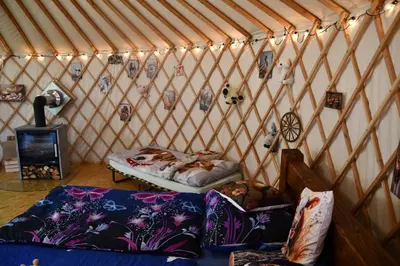 a room with a bed in a yurt at 01 JURTA šedá u stodoly