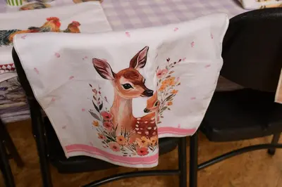 a chair with a painting of a deer on it at 01 JURTA šedá u stodoly