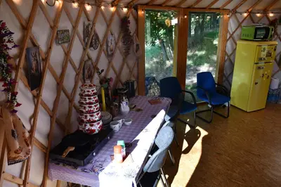 a room with a table in a yurt at 01 JURTA šedá u stodoly