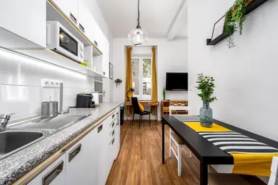 a kitchen with a sink and a counter top at Botanica Suite Prague in Prague