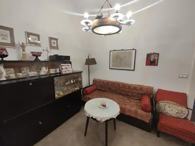 a living room with a couch and a table at Prague-2 Vinohrady Apartment in Prague