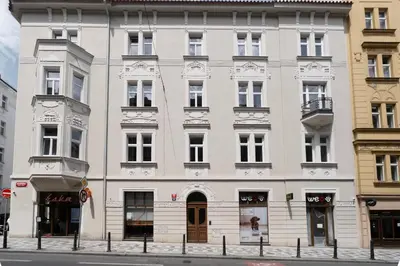 an empty street in a city with buildings at Blueground Holešovice balcony nr Vltava PRG-55 in Prague
