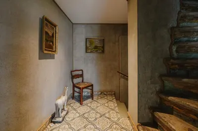 a room with a dog and a chair in it at Statek Pazderna