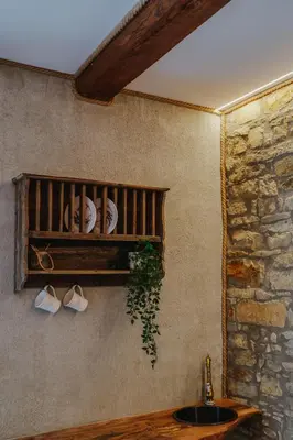 a bathroom with a sink and a shelf at Statek Pazderna